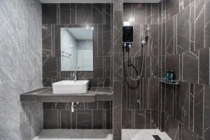 a bathroom with a sink and a shower at S21 Mellow Phromphong in Bangkok +21 photos