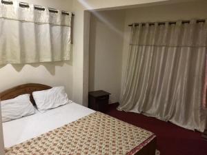 Postel nebo postele na pokoji v ubytování Highlander inn Skardu + 24 fotografií