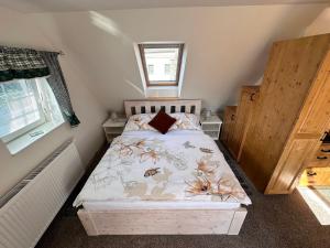 Posteľ alebo postele v izbe v ubytovaní Apartmány Hanička