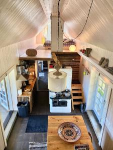 an overhead view of a kitchen in a tiny house at Cozy Holiday Cottage in Haapsu