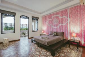 เตียงในห้องที่ Botan Boutique Hotel