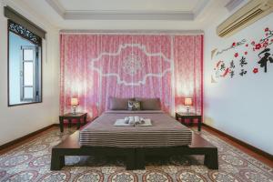 เตียงในห้องที่ Botan Boutique Hotel