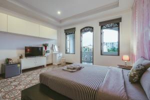 เตียงในห้องที่ Botan Boutique Hotel