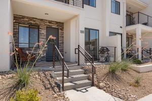 a home with a staircase leading to the front door at Sun, Sand, and Smiles #100 condo in St. George