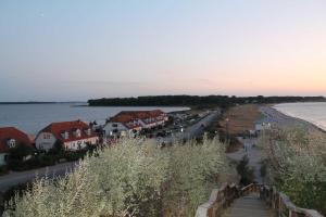 a town next to the water with houses at Landhaus Alte Schule nahe Ostseebad Rerik XL in Alt Bukow