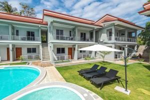 an image of a house with a swimming pool at Azahar Resort Panglao powered by Cocotel in Panglao Island