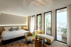 Postel nebo postele na pokoji v ubytování REY Hotel Hanoi + 37 fotografií