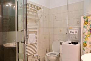 a bathroom with a toilet and a sink and a shower at Rouen Saint Romain - Chez Solange in Rouen +12 photos