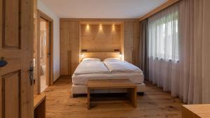 Postel nebo postele na pokoji v ubytování ALMA mountain residence