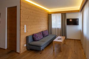 TV a/nebo společenská místnost v ubytování ALMA mountain residence