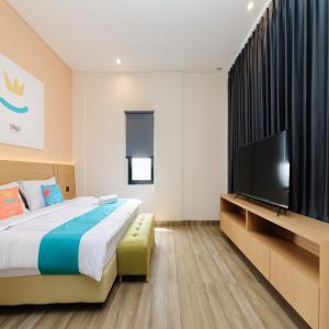 Postel nebo postele na pokoji v ubytování Sans Hotel Kedoya