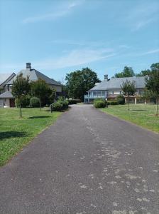 an empty road in a residential neighborhood with houses at Au pied de la Dordogne in Argentat