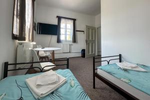 Postel nebo postele na pokoji v ubytování Hotel RON