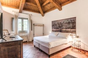 Postel nebo postele na pokoji v ubytování Casale Giancesare Villa Agricola