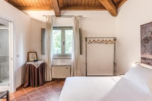 Postel nebo postele na pokoji v ubytování Casale Giancesare Villa Agricola