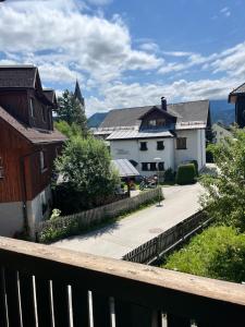 a view from the balcony of a town with houses at Sunside Apartments in Bad Mitterndorf