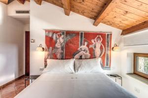 Postel nebo postele na pokoji v ubytování Casale Giancesare Villa Agricola