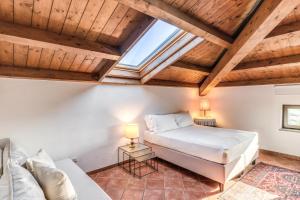 Postel nebo postele na pokoji v ubytování Casale Giancesare Villa Agricola
