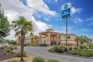 a sign in front of a hotel exterior at Best Western Canton Inn in Canton