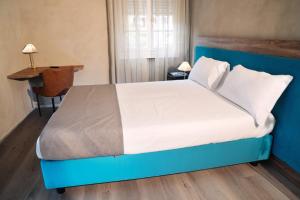 Łóżko lub łóżka w pokoju w obiekcie Hotel Conca D'Oro ***S