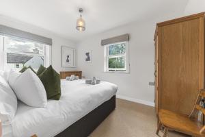 Postel nebo postele na pokoji v ubytování Derwent Cottage