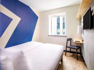 ibis budget Manchester Airport T2客房内的一张或多张床位