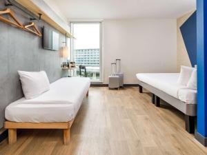ibis budget Manchester Airport T2客房内的一张或多张床位