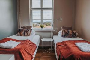 Postelja oz. postelje v sobi nastanitve Héradsskólinn Historic Guesthouse