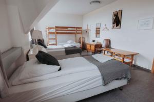 Postelja oz. postelje v sobi nastanitve Héradsskólinn Historic Guesthouse