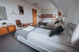 Postelja oz. postelje v sobi nastanitve Héradsskólinn Historic Guesthouse