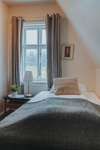 Postelja oz. postelje v sobi nastanitve Héradsskólinn Historic Guesthouse