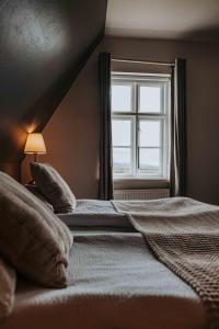 Postelja oz. postelje v sobi nastanitve Héradsskólinn Historic Guesthouse