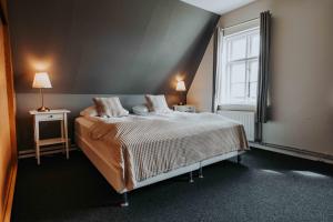 Postelja oz. postelje v sobi nastanitve Héradsskólinn Historic Guesthouse