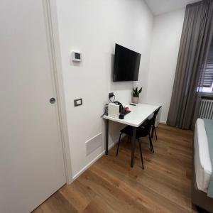 TV a/nebo společenská místnost v ubytování Sunrise Rooms