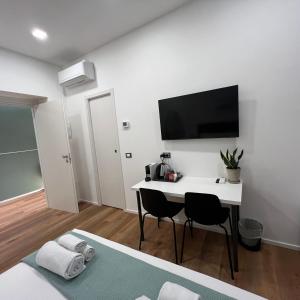 TV a/nebo společenská místnost v ubytování Sunrise Rooms