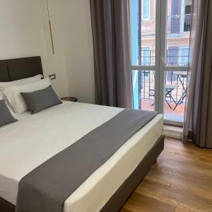 Postel nebo postele na pokoji v ubytování Sunrise Rooms