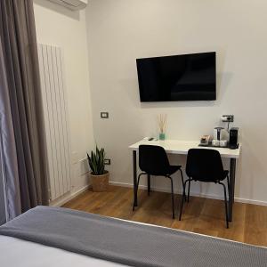 TV a/nebo společenská místnost v ubytování Sunrise Rooms