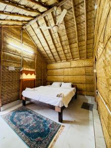 En eller flere senger på et rom på Tamarind Tree Way Side Amenities