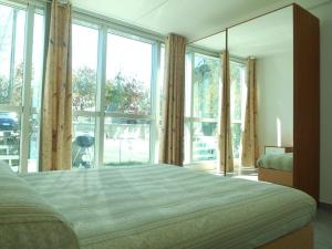 Postel nebo postele na pokoji v ubytování Direttamente Al Lago Apartments