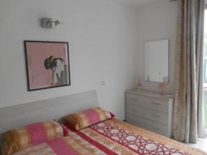 Postel nebo postele na pokoji v ubytování Direttamente Al Lago Apartments