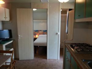 A kitchen or kitchenette at Villaggio Camping Europa