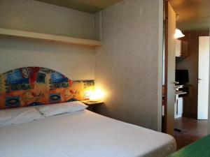 A bed or beds in a room at Villaggio Camping Europa