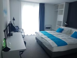 Postel nebo postele na pokoji v ubytování Hôtel de la Source