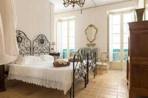Katil atau katil-katil dalam bilik di Charmante vakantiewoning 'Casa Di Tonno'