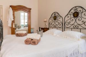 Katil atau katil-katil dalam bilik di Charmante vakantiewoning 'Casa Di Tonno'
