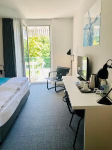 Voodi või voodid majutusasutuse Hôtel de la Source toas