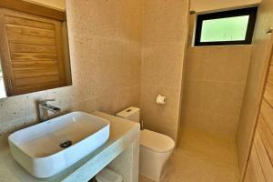 Baðherbergi á Villa Capri piscine jacuzzi vue mer