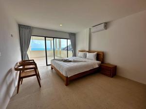 Rúm í herbergi á Villa Capri piscine jacuzzi vue mer