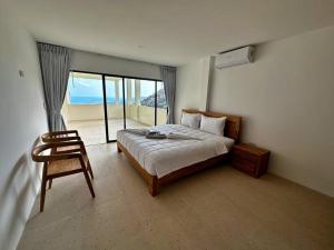 Rúm í herbergi á Villa Capri piscine jacuzzi vue mer