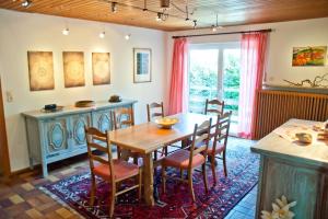 a dining room with a table and chairs at Buddha Lounge in Dinkelsbühl